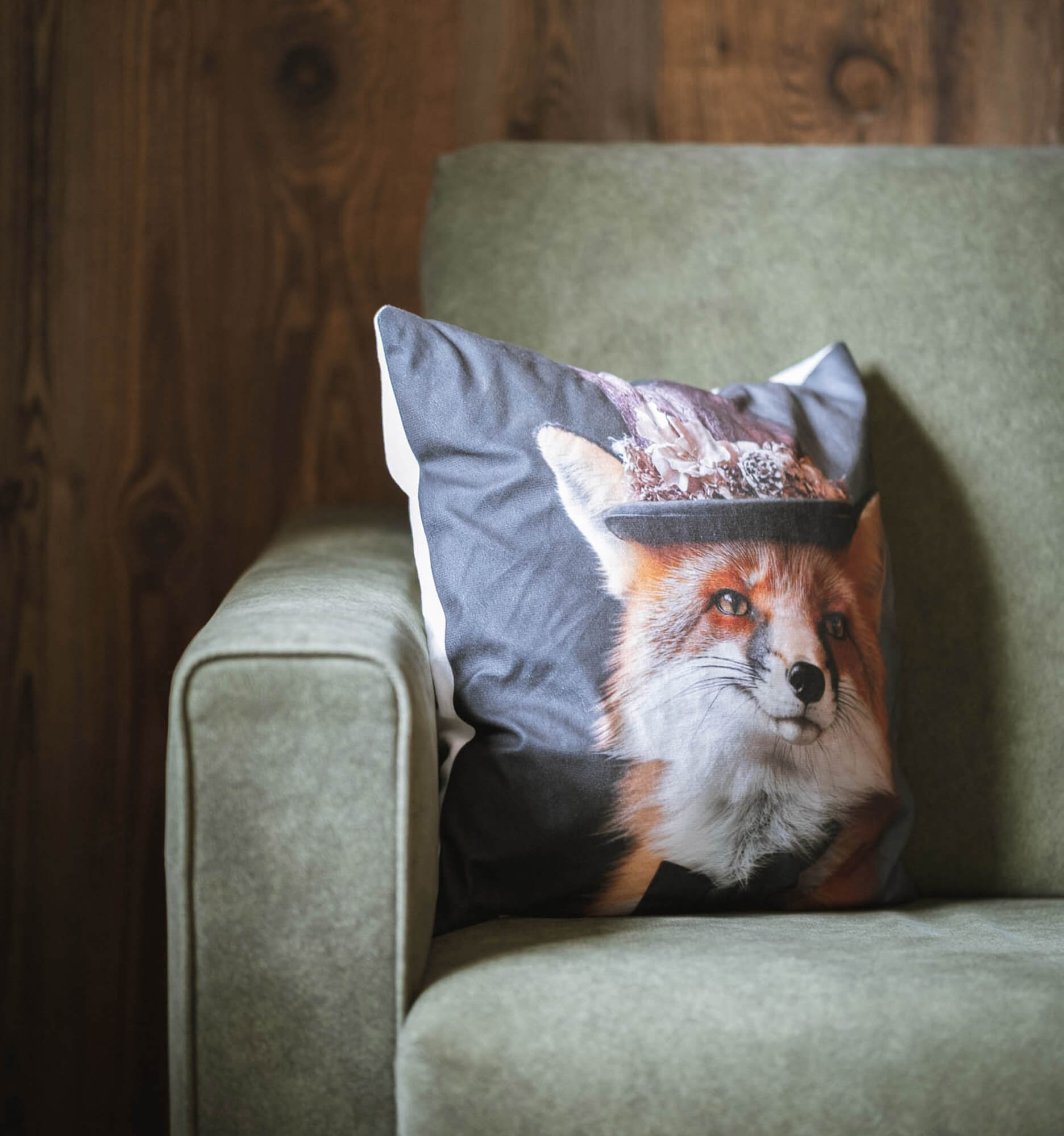 Detail - green sofa with fox cushion
